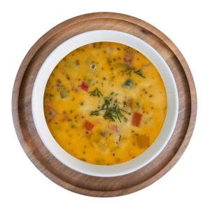 Creamy soup with salmon and vegetables